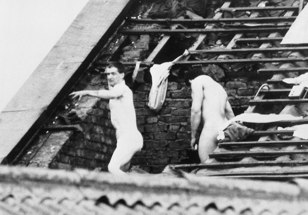 Naked inmates on the roof of Strangeways, where the riots had reached the 1...