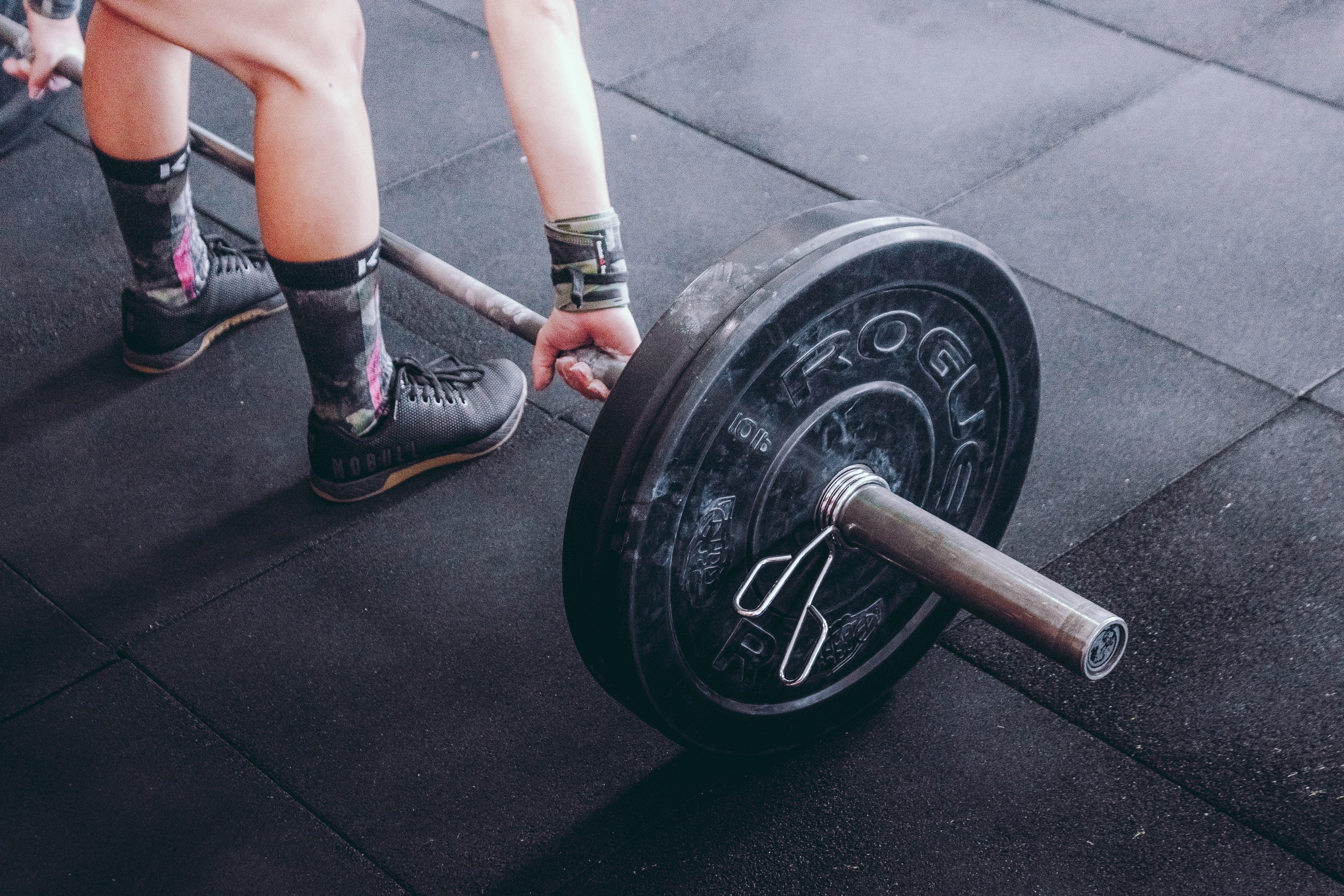 person getting ready to lift weights