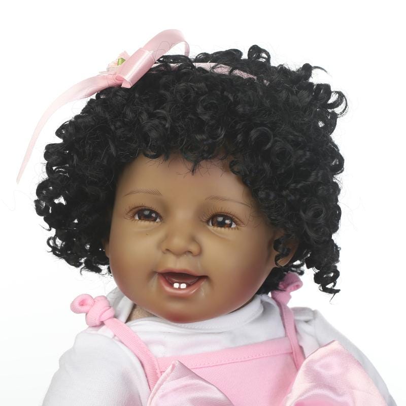 black baby doll with curly hair