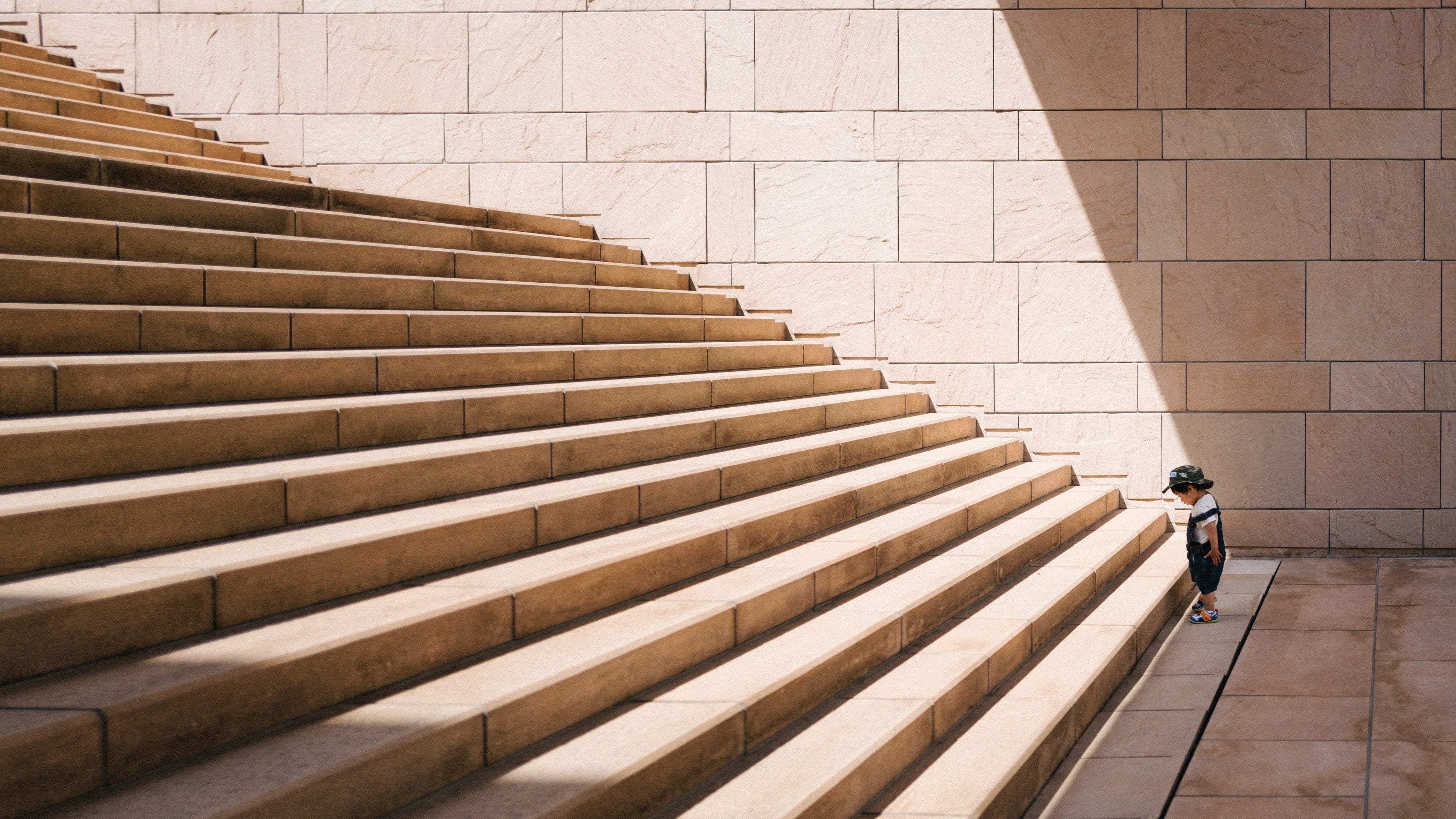 A small kid staring at steps