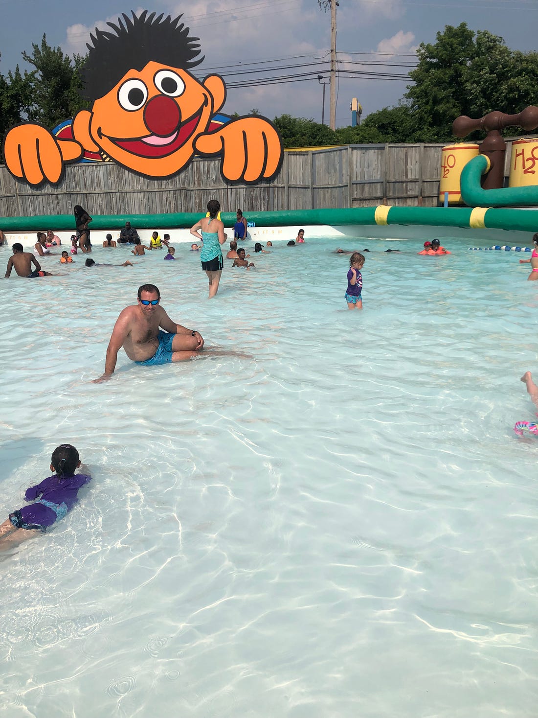 Photograph shows a wave pool with toddlers in it.