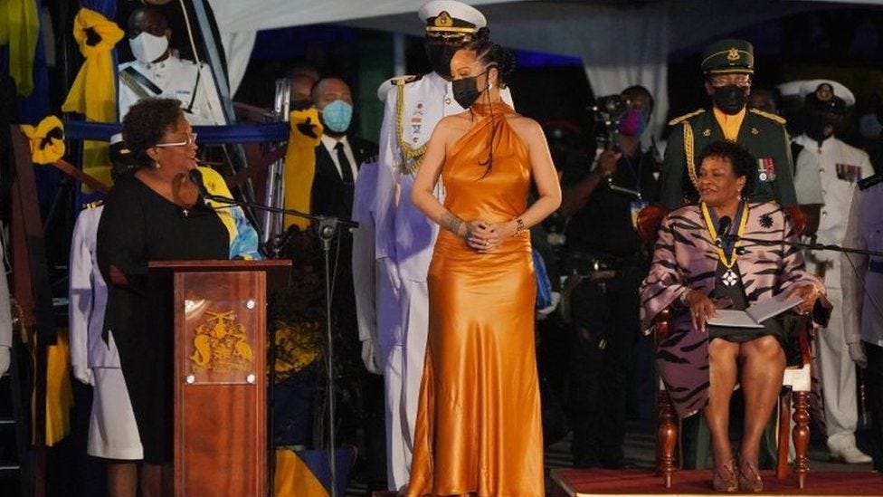 Rihanna (centre) attends the Presidential Ceremony in Heroes Square, Bridgetown