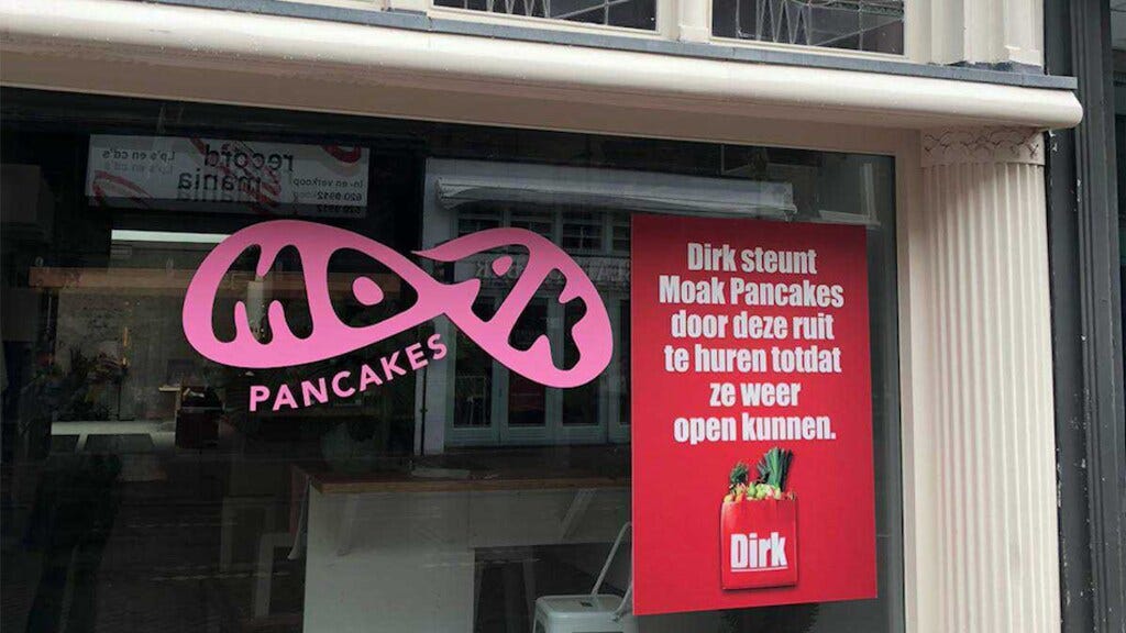 Moat Pancakes and Dirk van den Broek billboard on closed store