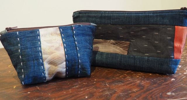 Photograph of two patchwork/boro zip bags.