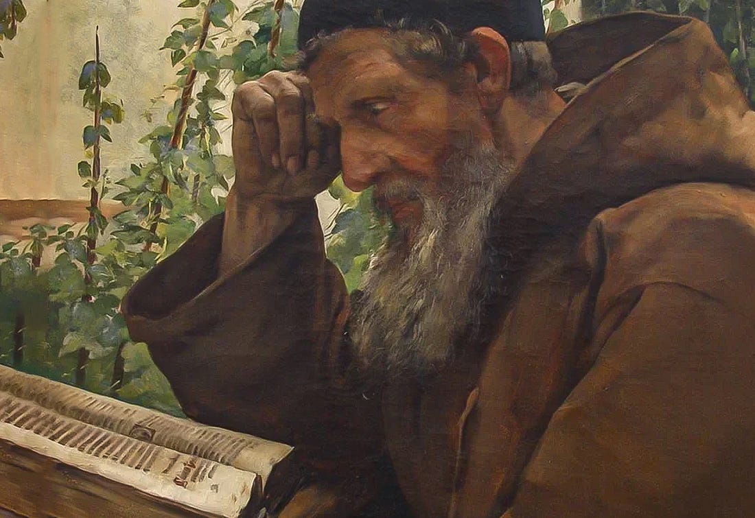 old priest reading bible