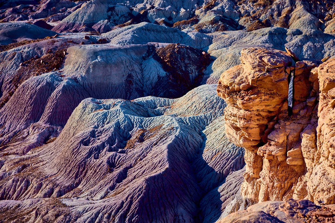landscape of blue painted hills and yellow sandstone