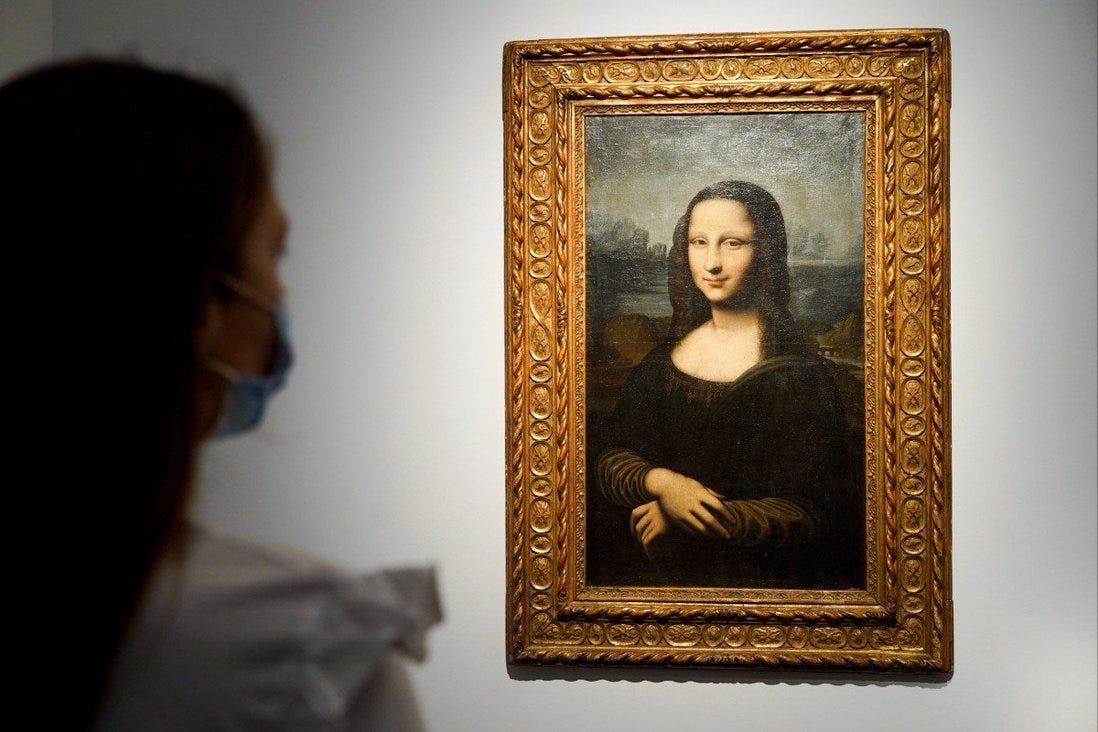 A woman looks at the Hekking Mona Lisa, a reproduction of Leonardo Da Vinci’s Mona Lisa, at Christie’s auction house in Paris. Photo: Reuters