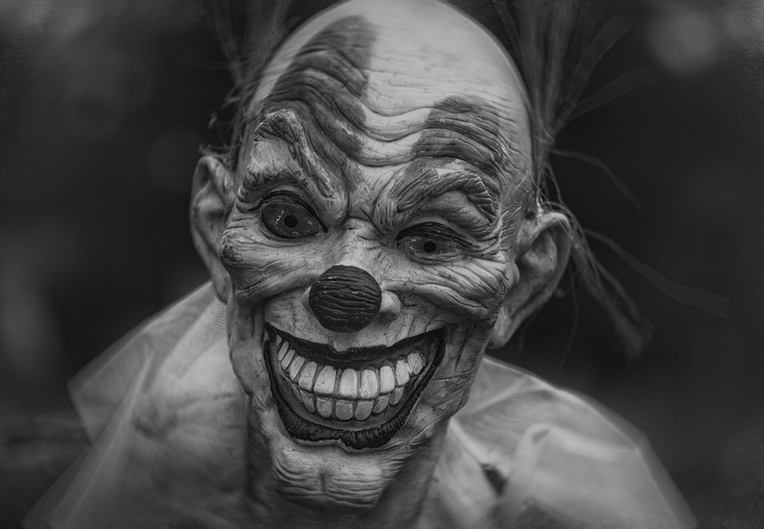 black and white image of a weird clown for article by Larry G. Maguire