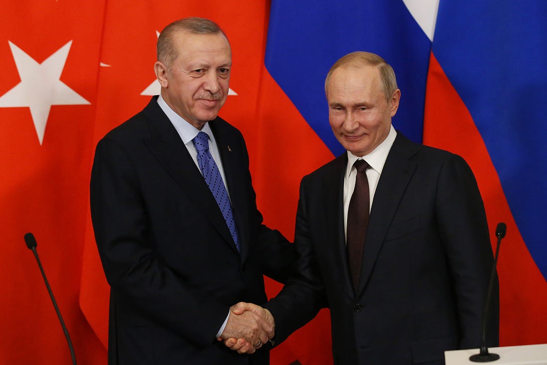 Russian President Vladimir Putin and Turkish President Recep Tayyip Erdogan shake hands during their talks at the Kremlin on March 5, 2020 in Moscow, Russia. Erdogan is having a one day visit to Russia to discuss the war conflcit in Syria. (Photo by Mikhail Svetlov/Getty Images)