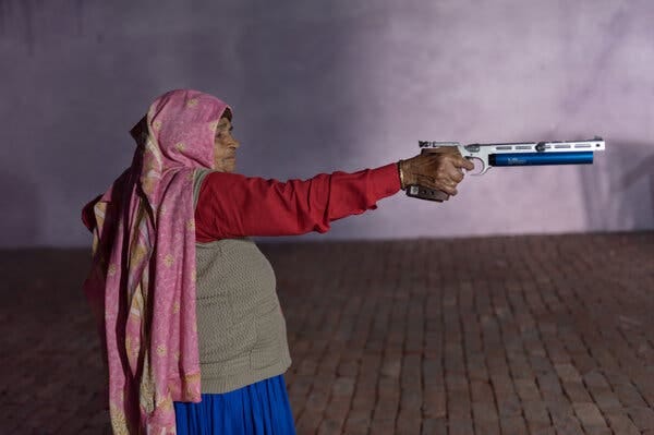 Chandro Tomar practicing with an air pistol last month at the site of a shooting range she is building in her home in the Indian state of Uttar Pradesh.