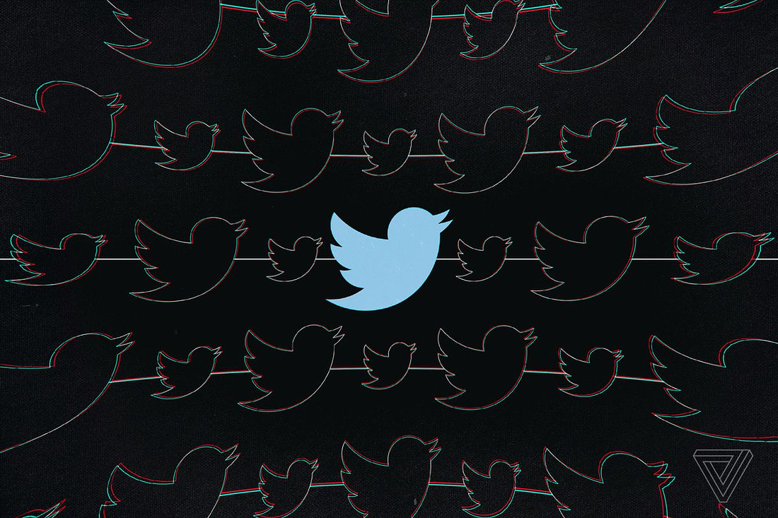 Twitter’s blue bird silhouette logo on a black background.