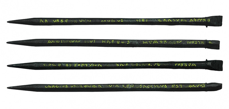 A unique inscribed Roman stylus uncovered by MOLA archaeologists during excavations for Bloomberg's European headquarters in London. The inscription has been highlighted in yellow (c) MOLA