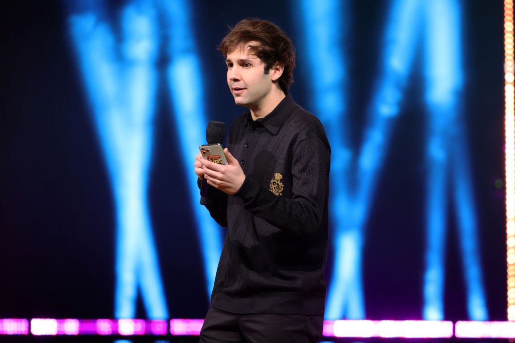 David Dobrik speaks onstage during Nickelodeon's Kids' Choice Awards March 13 at Barker Hangar in Santa Monica, California. (Photo by Rich Fury/KCA2021/Getty Images for Nickelodeon)