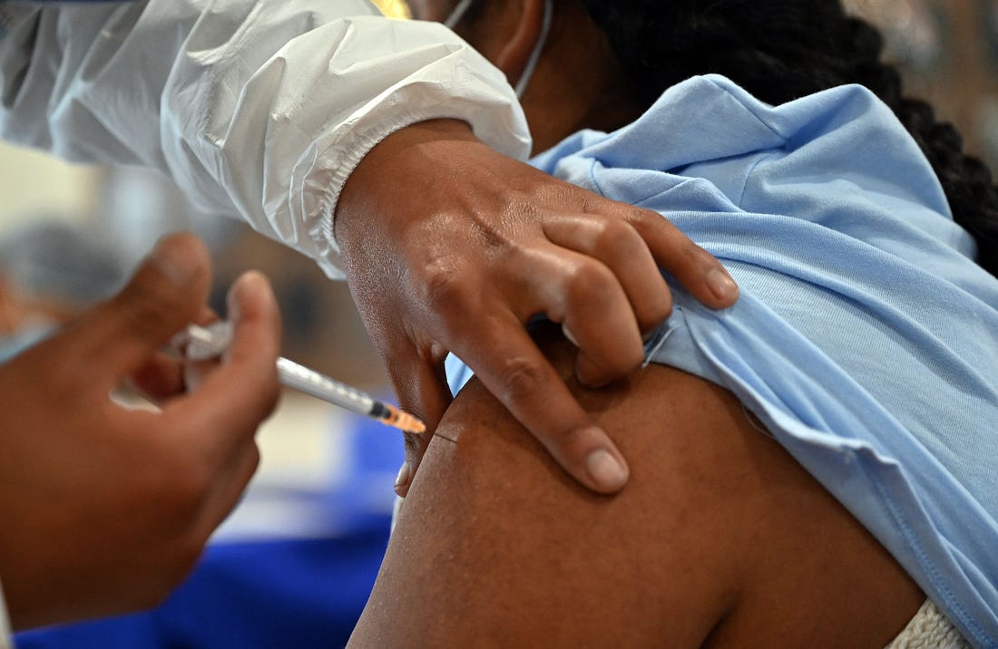A woman is inoculated with the Johnson & Johnson vaccine against COVID-19 at a vaccination centre in La Paz, Bolivia on Monday. (Aizar Raldes / Getty Images)