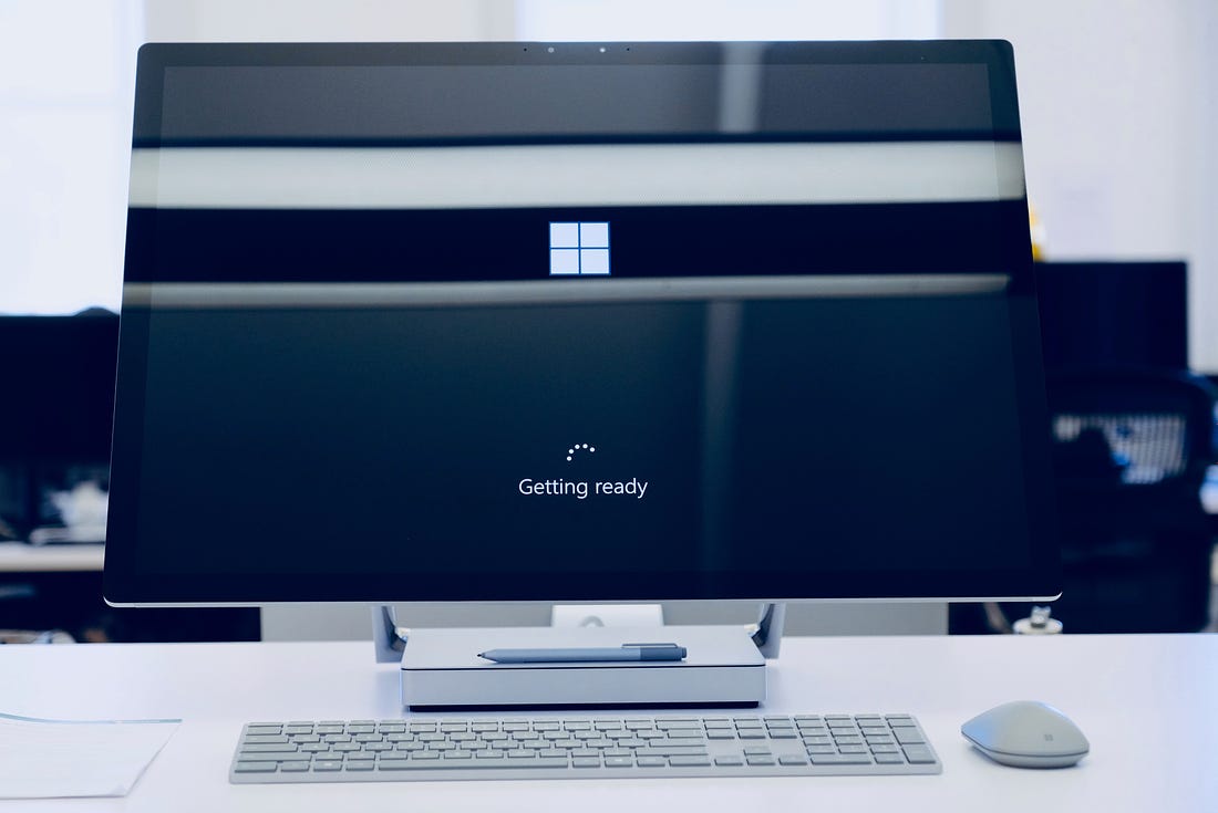 Photo of a Windows PC with a monitor with display text reading 'Getting ready'. Johny Vino / Unsplash
