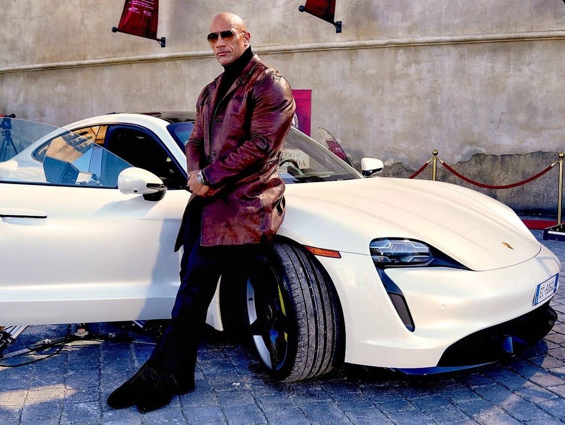 The Rock and his one of his (several) super–cars. Photo: @therock/Instagram