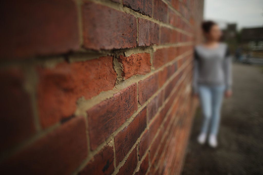 A teenage girl, who claims to be a victim of sexual abuse and alleged grooming, poses in Rotherham on September 3, 2014 in Rotherham, England. South Yorkshire Police have launched an independent investigation into its handling of the Rotherham child abuse scandal and will also probe the role of public bodies and council workers. A report claims at least 1,400 children as young as 11 were sexually abused from 1997- 2013 in Rotherham. (Photo by Christopher Furlong/Getty Images)