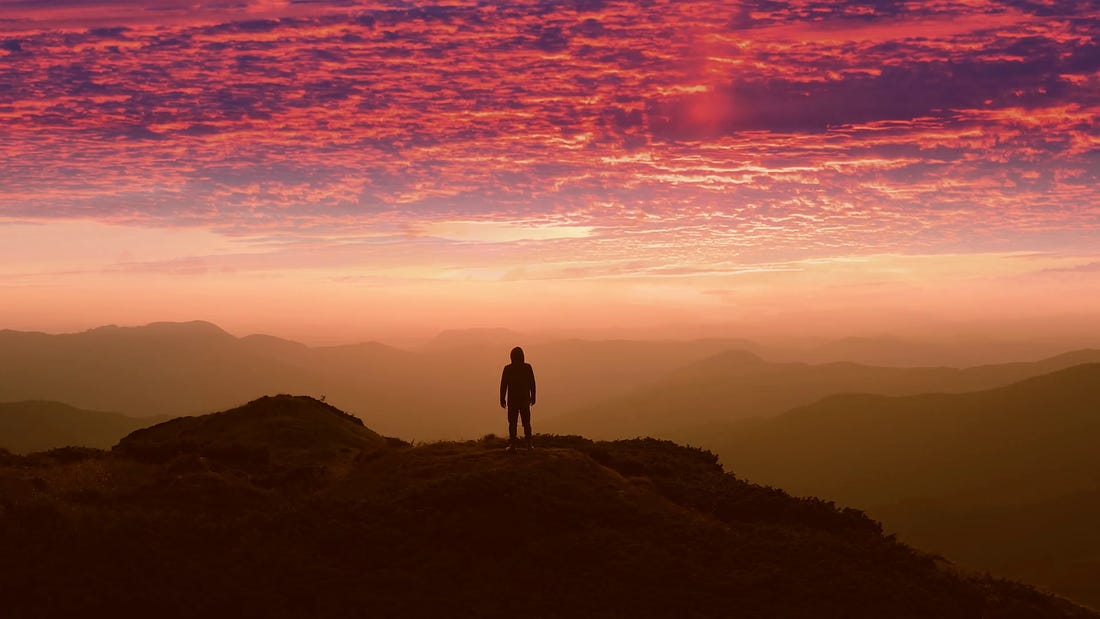 The man standing on a mountain top against the beautiful sunset Stock Video  Footage - Storyblocks