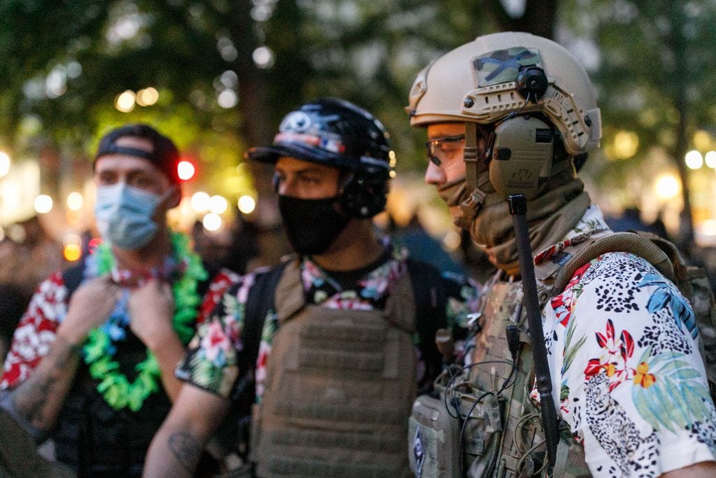 PORTLAND, OREGON, USA - JULY 24: The 'Boogaloo Bois', an armed libertarian group, dress in their signature Hawaiian shirts during a protest on 24, 2020 in Portland, United States. Thousands of people, including mothers, lawyers, health-care workers, and veterans demonstrated in Portland, Oregon on July 24, 2020 for racial justice, and against Donald Trumpâs insertion of Federal officers into Portland, Oregon. (Photo by John Rudoff/Anadolu Agency via Getty Images) PORTLAND, OREGON, USA - JULY 24: The 'Boogaloo Bois', an armed libertarian group, dress in their signature Hawaiian shirts during a protest on 24, 2020 in Portland, United States. Thousands of people, including mothers, lawyers, health-care workers, and veterans demonstrated in Portland, Oregon on July 24, 2020 for racial justice, and against Donald Trumpâs insertion of Federal officers into Portland, Oregon. (Photo by John Rudoff/Anadolu Agency via Getty Images)