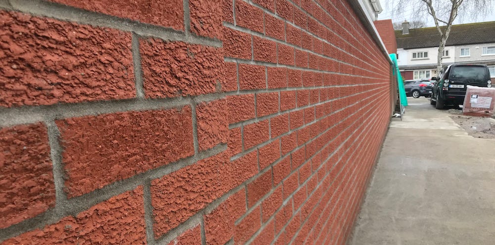 Image of a brick wall built with skill and attention to detail