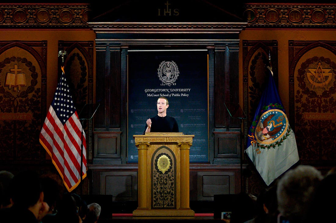 Mark Zuckerberg speaks at a podium at Georgetown University