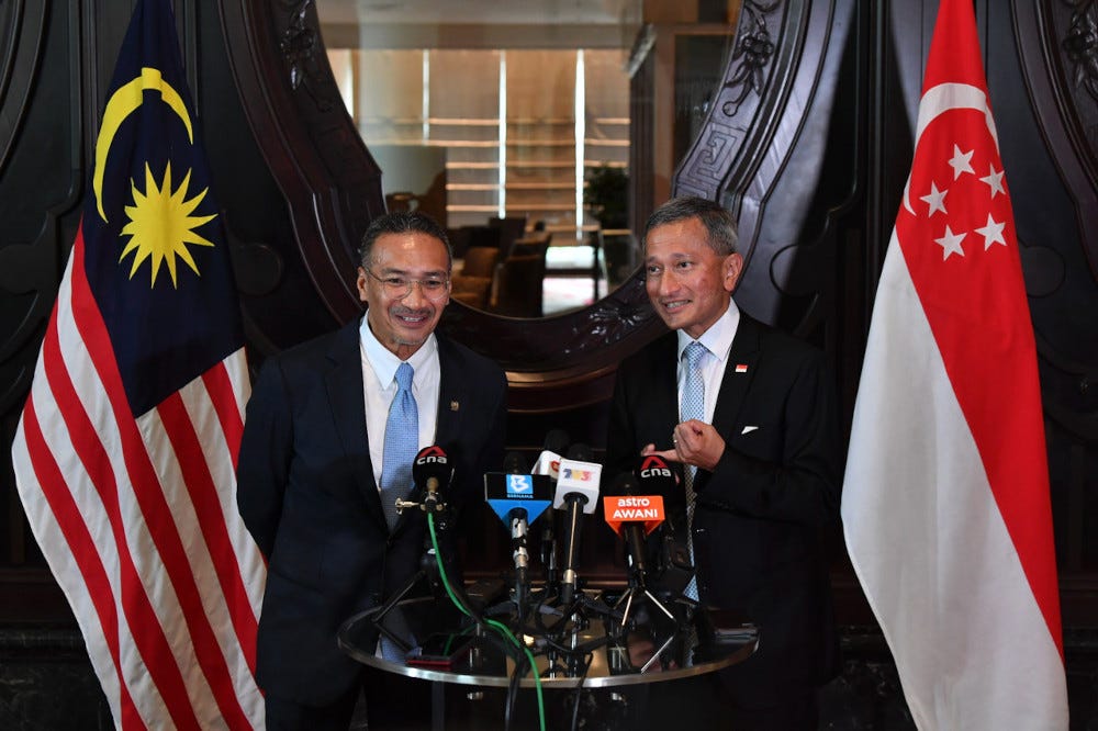 Foreign Minister Hishammuddin Hussein with his Singapore counterpart Dr Vivian Balakrishnan hold a joint press conference after a bilateral meeting in Putrajaya, March 23, 2021. — Bernama pic