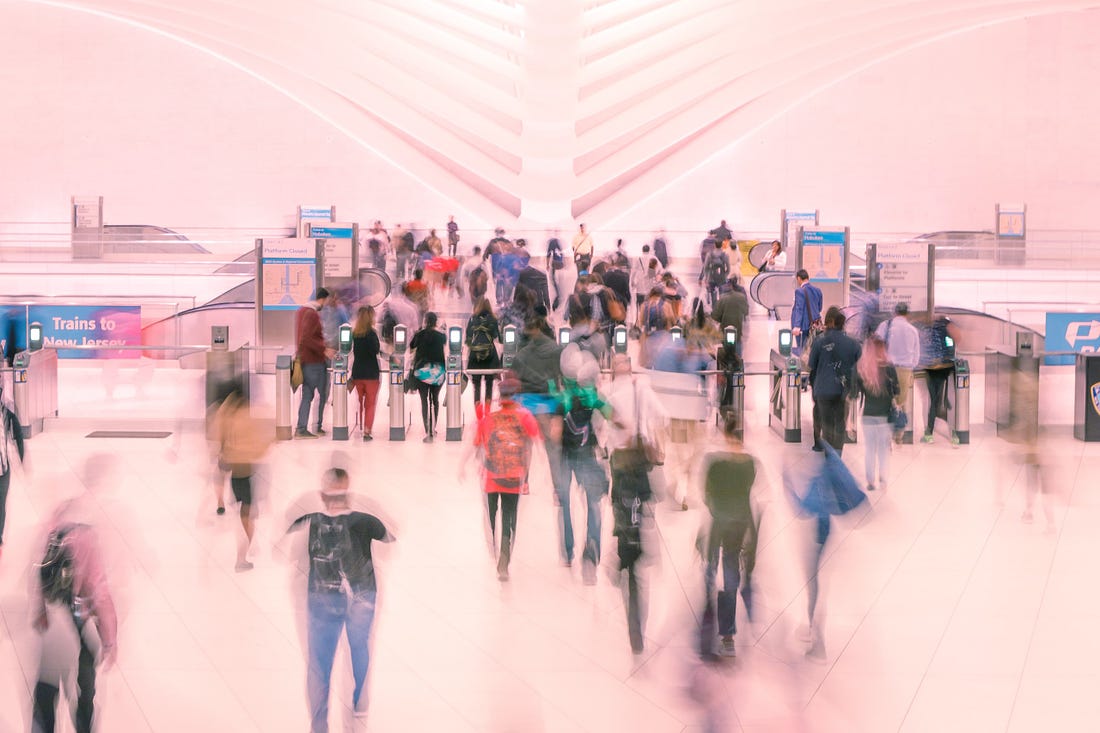 Blurred image of people in a mall for article by Larry G. Maguire