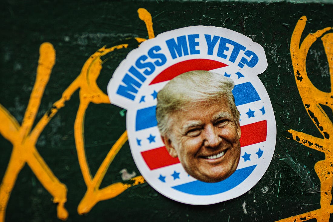 Trump's face on a sticker with the words "Miss me yet?" Jon Tyson / Unsplash