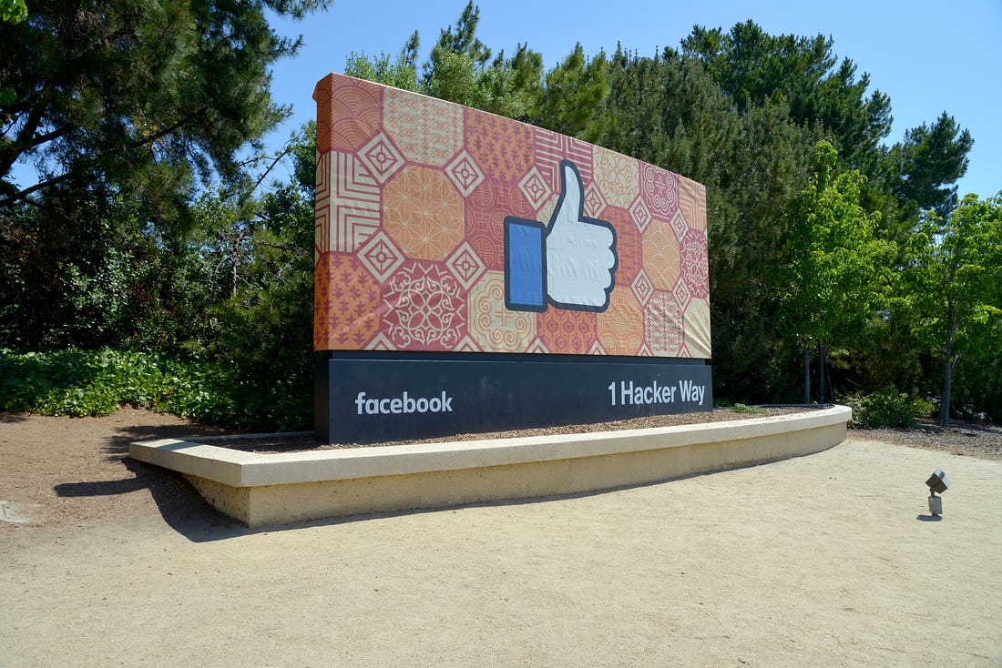 The sign outside Facebook headquarters in Menlo Park. (Greg Bulla / Unsplash)