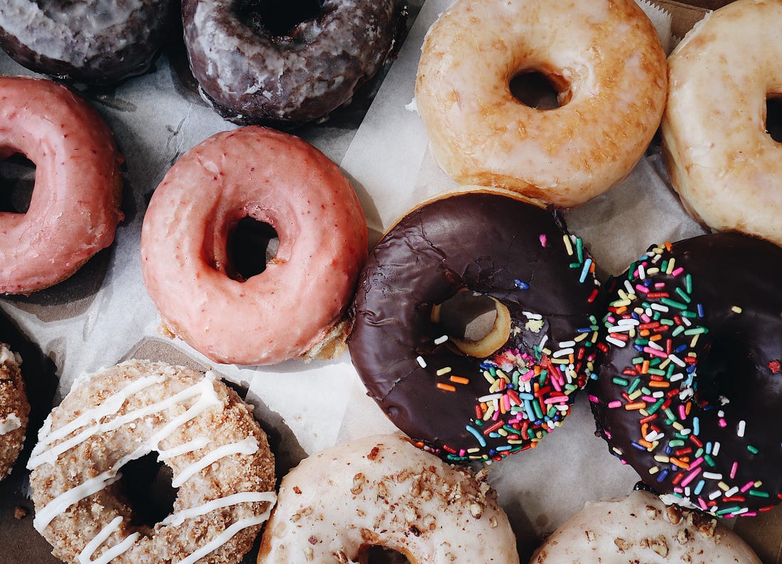 Image of a selection of doughnuts on a counter for article by Larry G. Maguire Day 2 of 5 Weeks to Fitness