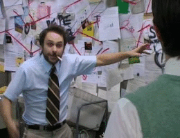 charlie day in front of his murder board gif