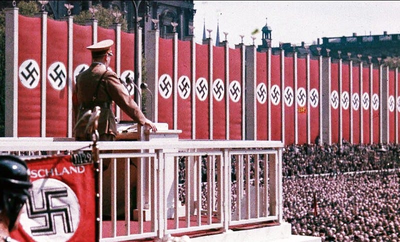 Hitler addresses a huge rally crowd.