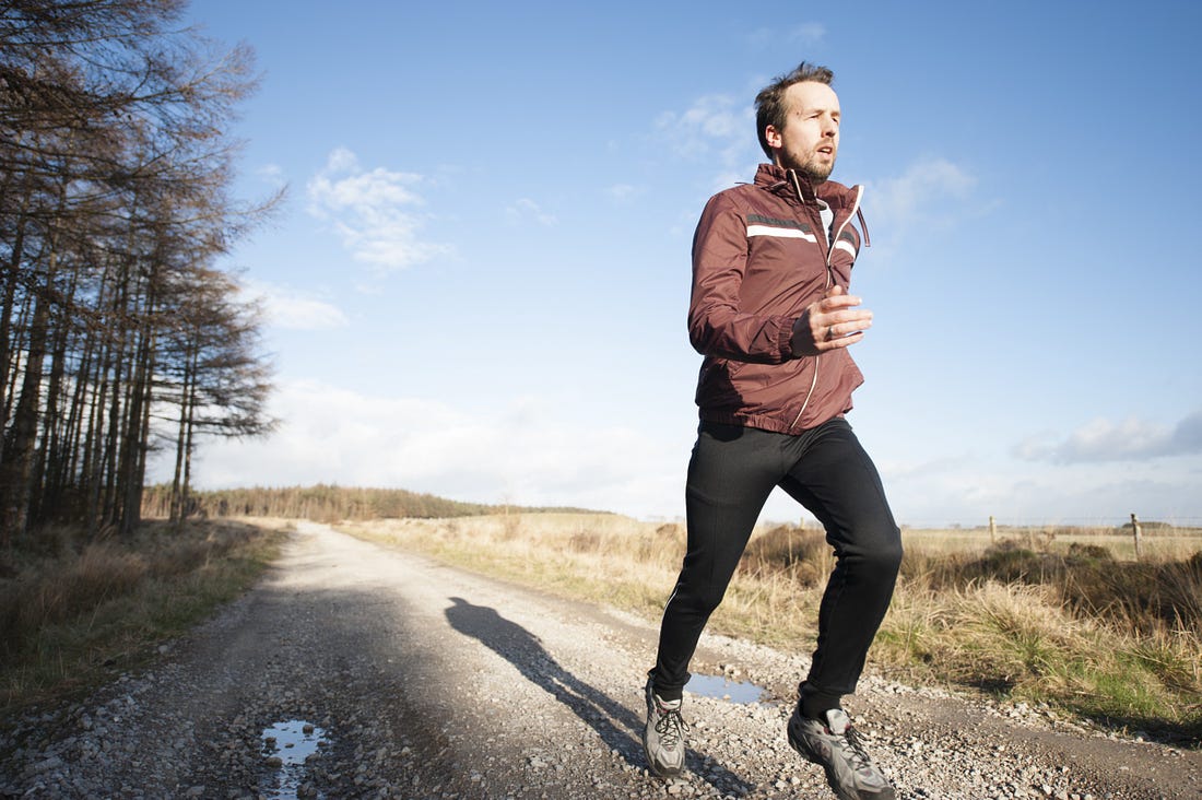 man jogging in the countryside for article by Larry G. Maguire