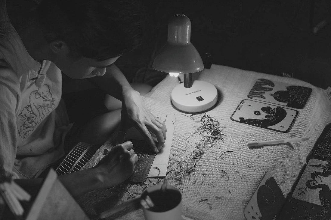 Image of a man making handmade crafts