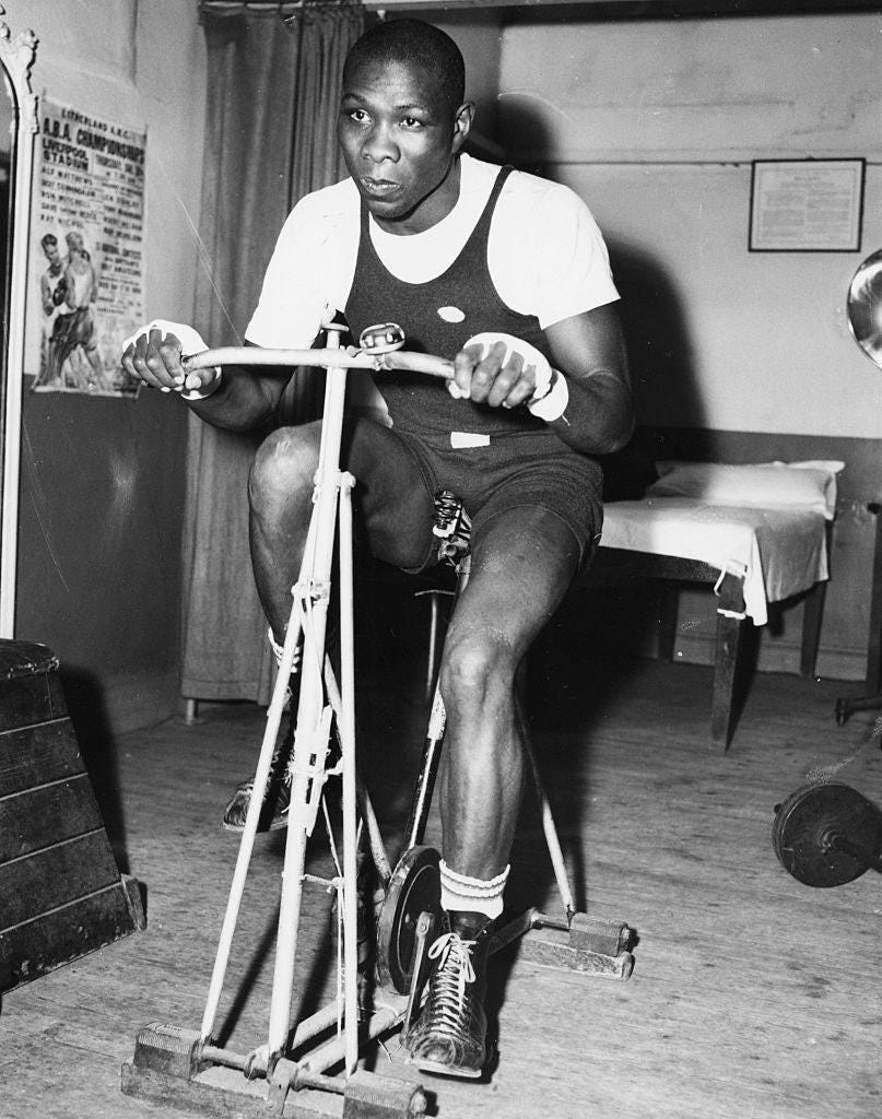 American boxer Sonny Ray working out on an exercise bike during training