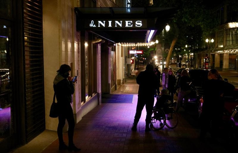 PMG PHOTO: ZANE SPARLING - Protesters gathered outside The Nines hotel on Friday evening after a foot chase involving a man claimed to be Andy Ngo. 