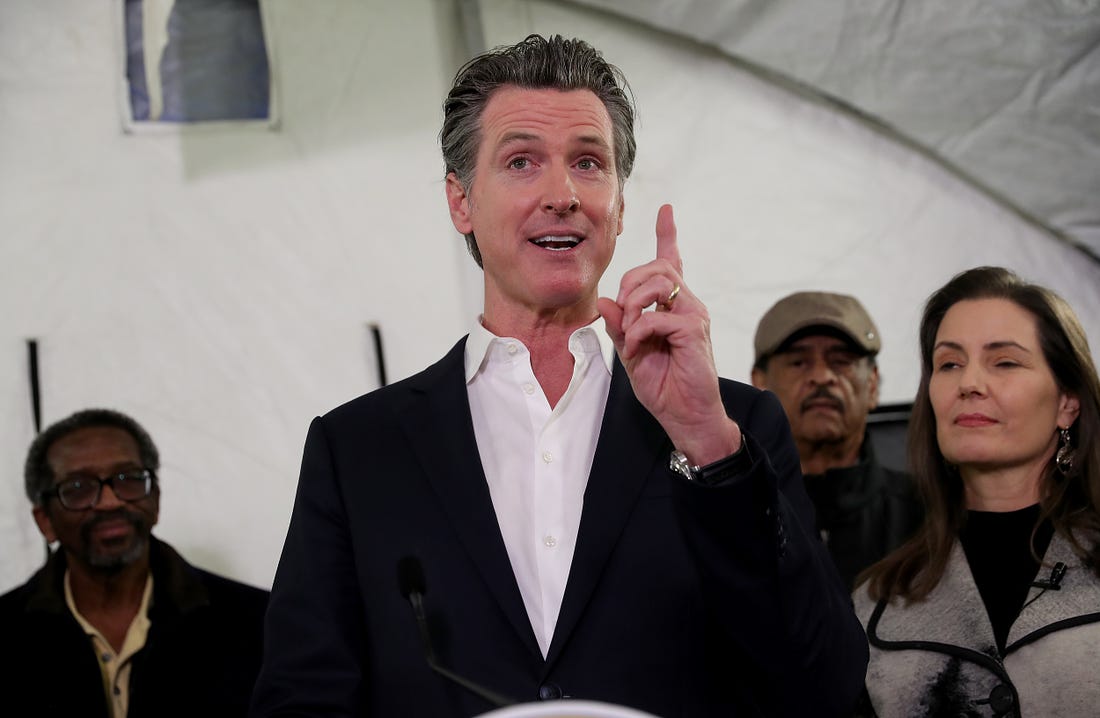 Gavin Newsom speaks at a press conference on homelessness in Oakland, Calif., on Thursday, Jan. 16, 2020. To the right is Oakland Mayor Libby Schaaf. The city will receive 15 unused FEMA trailers to use as temporary housing for homeless people. (Jane Tyska/Digital First Media/East Bay Times via Getty Images)