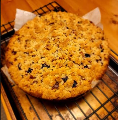 fully-baked round cake on a cooling rack