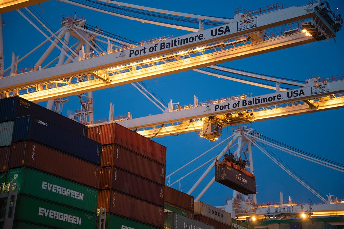 Stacked shipping containers and cranes at the Port of Baltimore USA