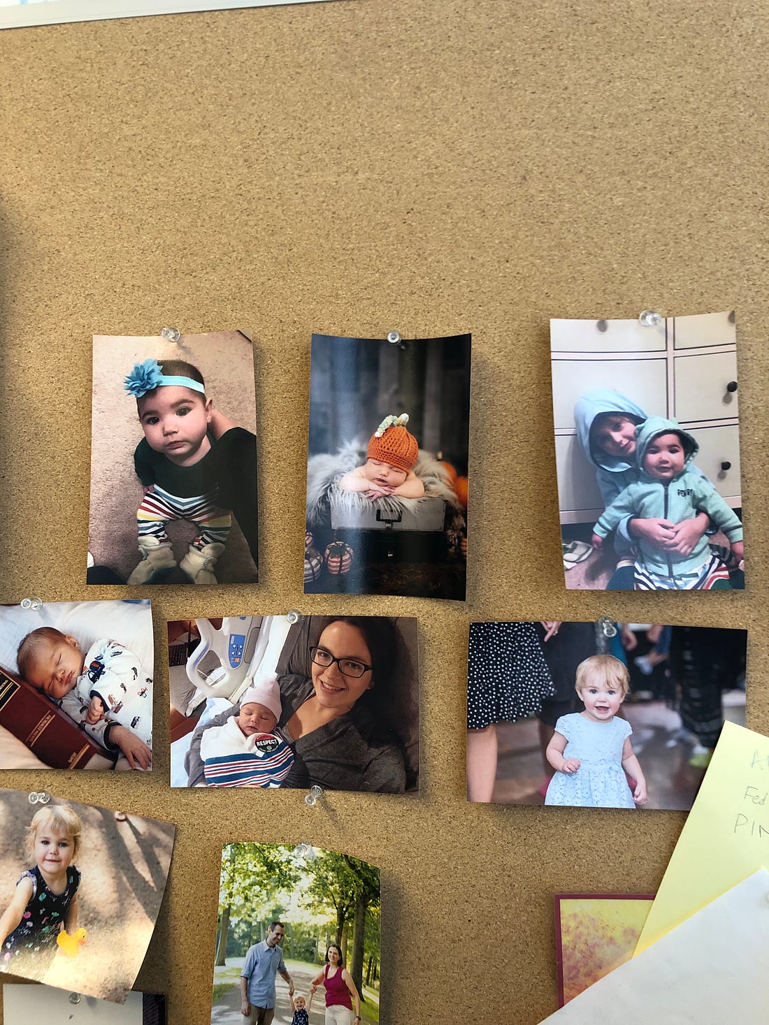 Photo of bulletin board with pictures of babies
