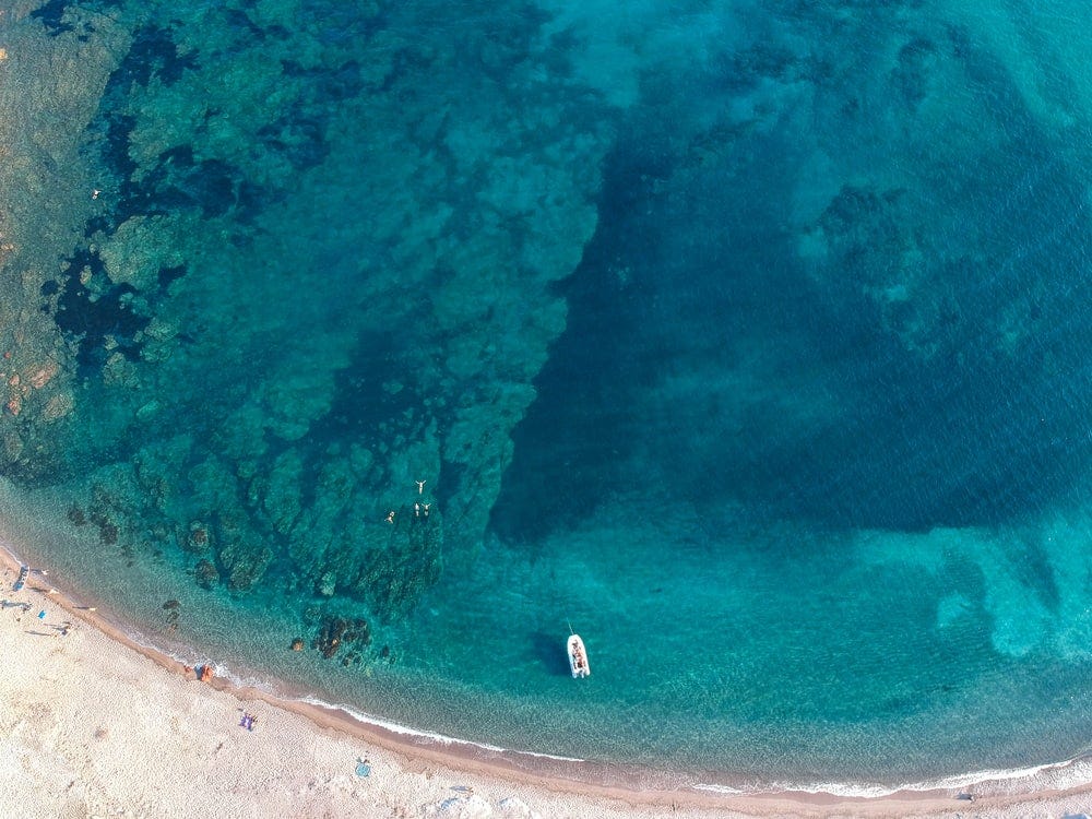 aerial photo of boat on body of water