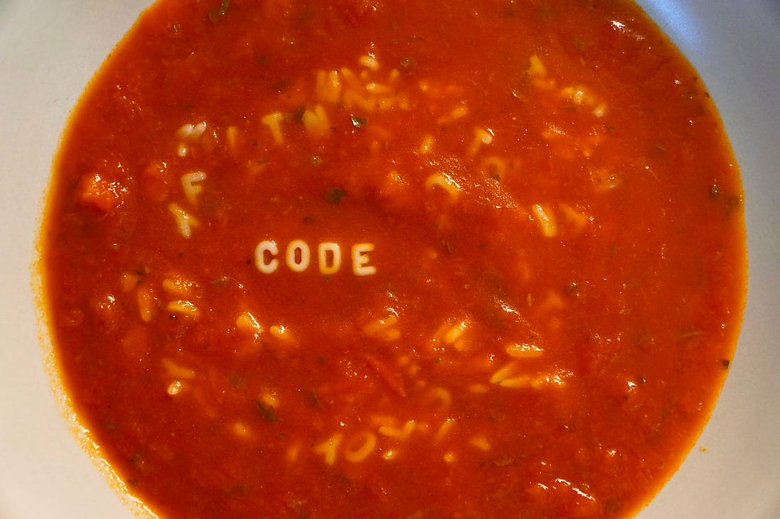code written in soup letters in bowl