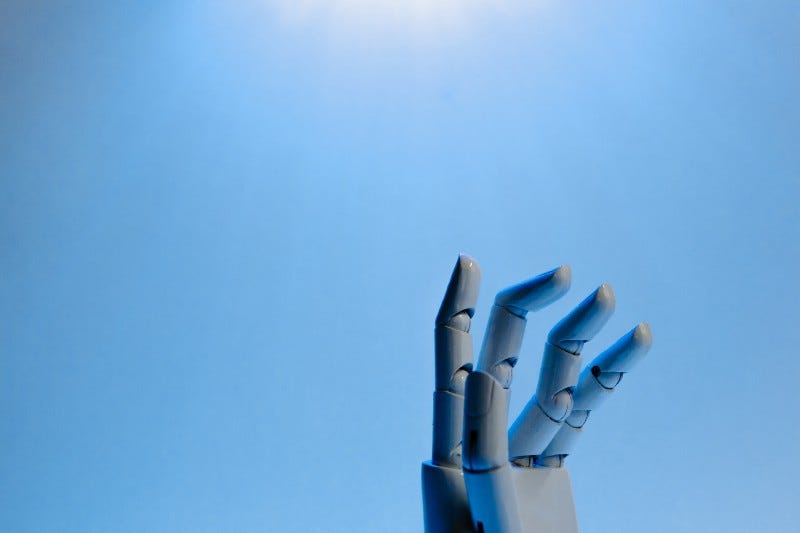 The fingers of a robot reach for the sky