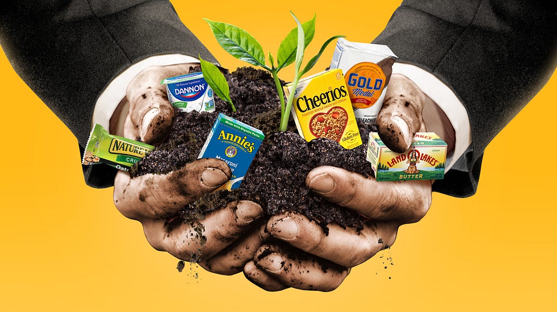 regenerative agriculture photo - a businessman holding soil and packaged foods from big food companies