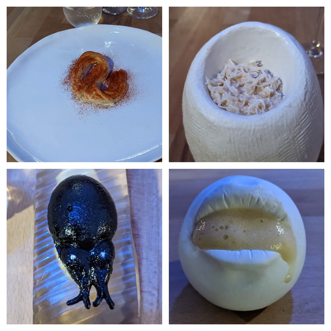 Four images from the review. Clockwise from the top left: A plate with six noodles (the largest dish of the night). A crappy looking bowl with about a teaspoon of white crabmeat that looks vaguely like cat food. A horrific shiny black blob that sort of looks like a slug. And a round ball with an actual cast of the chef’s mouth, out of which you are supposed to lick a truly repellent looking greenish-tan foam.