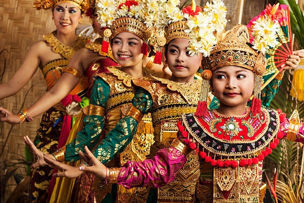 row of traditional balinese dancers in costume - indigenous culture stock pictures, royalty-free photos & images