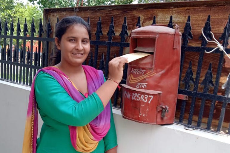 Priyakshi Jakhar, a resident of Haryana's Hisar district, posting her letter to PM Modi [Sunil Jaglan/Al Jazeera]