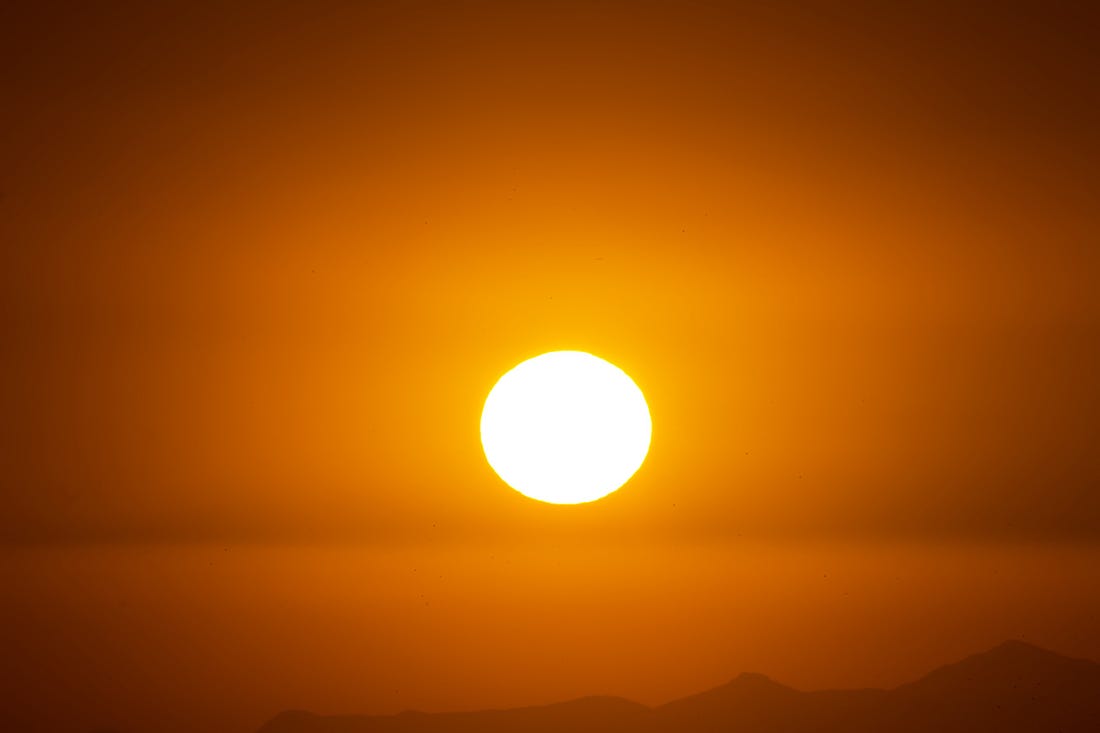 Image of the sun at sunrise for article by Larry G. Maguire
