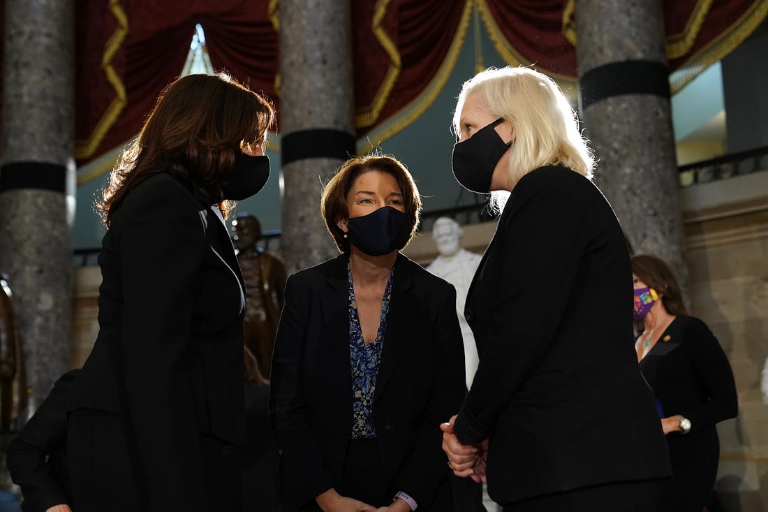 Democratic U.S. Vice Presidential nominee Sen. Kamala Harris (D-CA), Sen. Amy Klobuchar (D-MN) and Sen. Kirsten Gillibrand (D-NY) speak prior to a memorial service in honor of the late Associate Justice Ruth Bader Ginsburg in the Statuary Hall of the US Capitol, on September 25, 2020 in Washington, DC. 