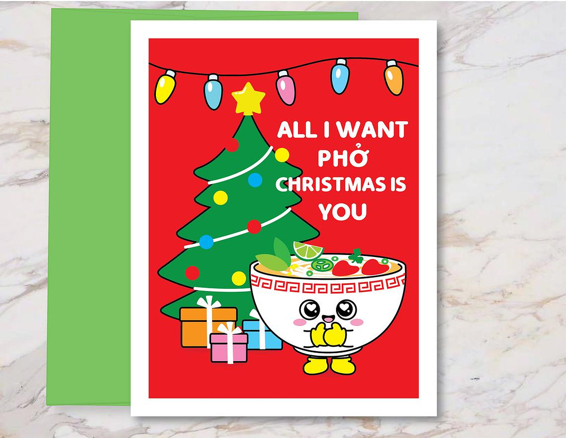 A red card with a christmas tree and lights, and a smiling illustration of a bowl of Pho